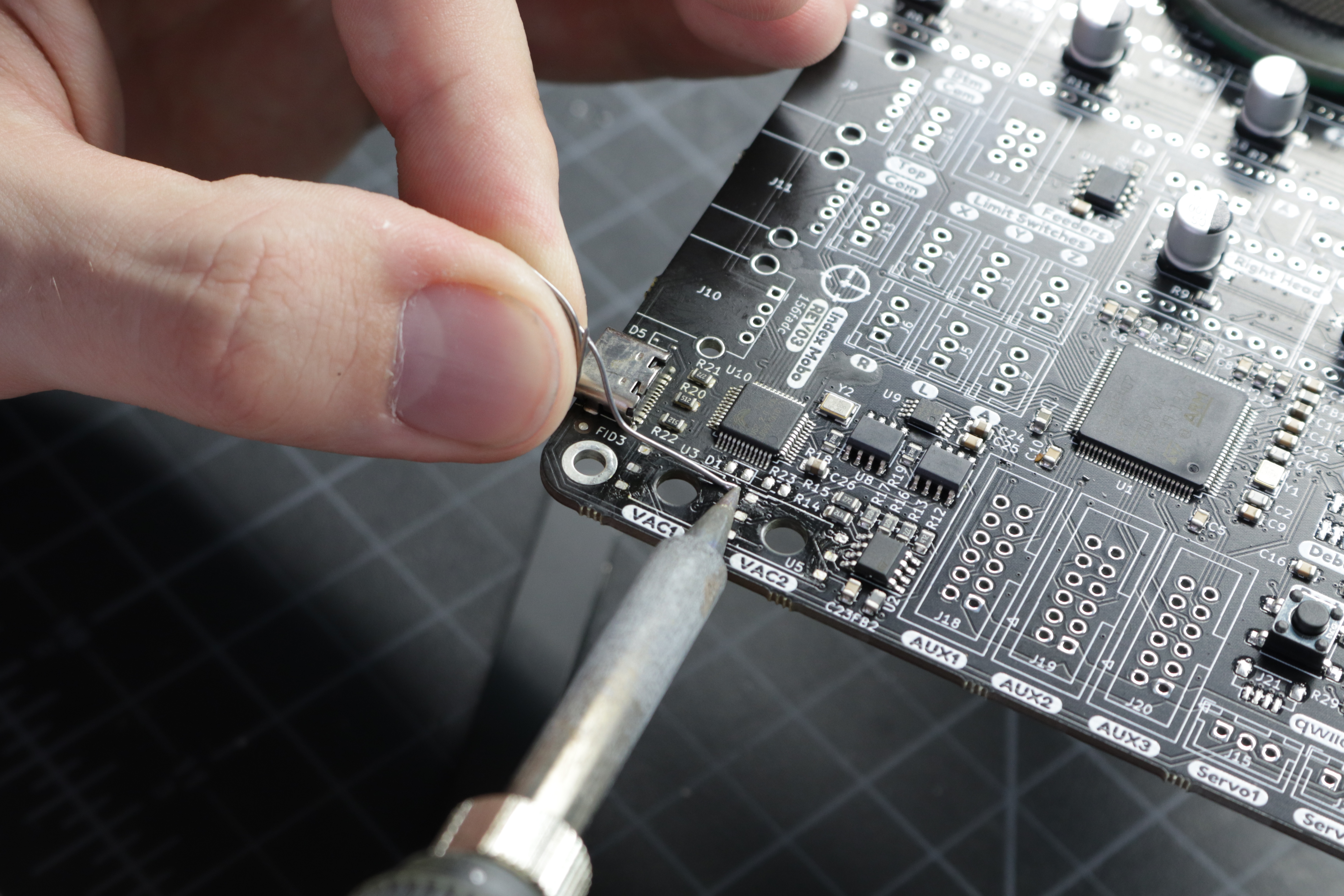 A photo of one pad on the motherboard's sensor footprint soldered