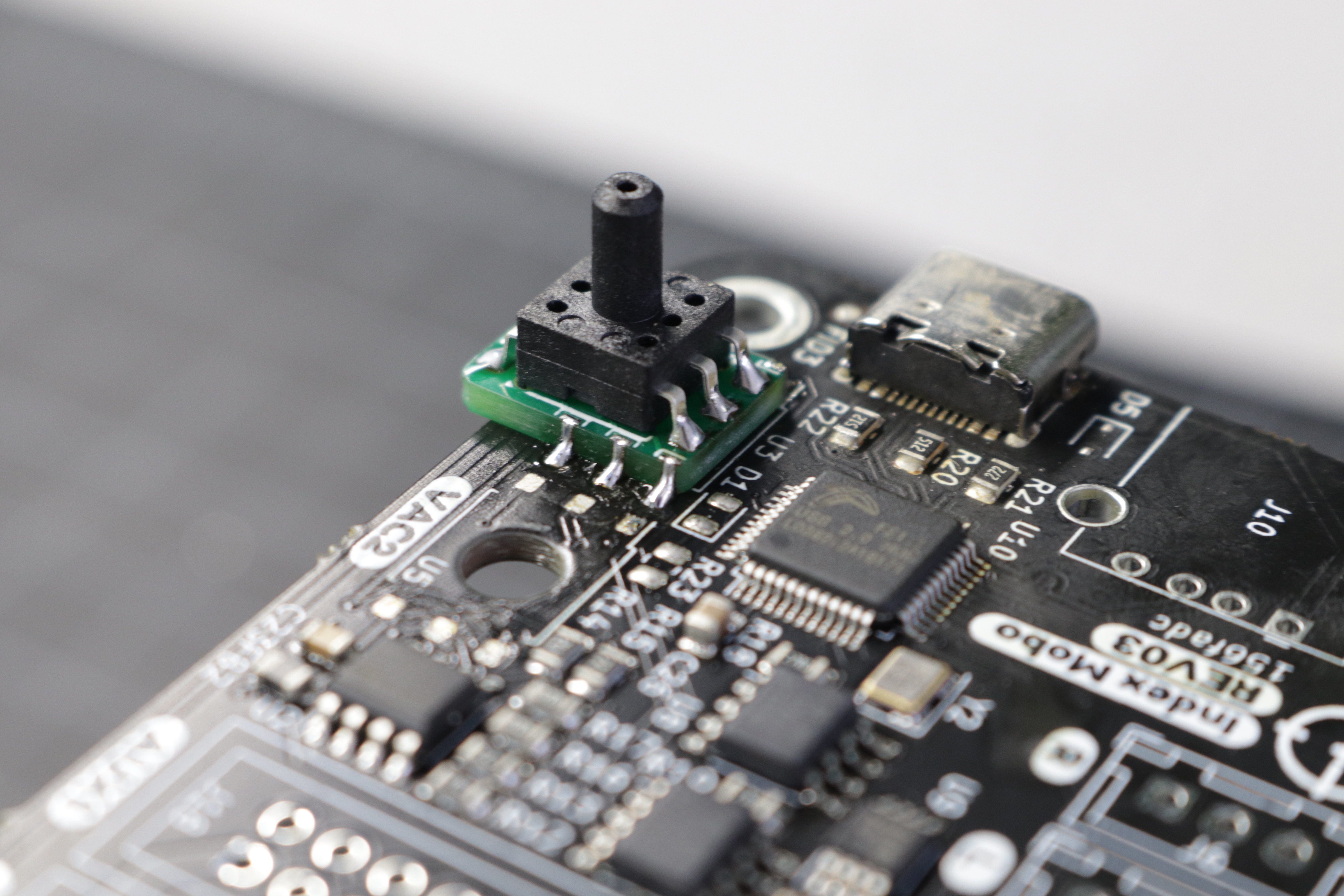 A photo of the interposer completely soldered to the motherboard