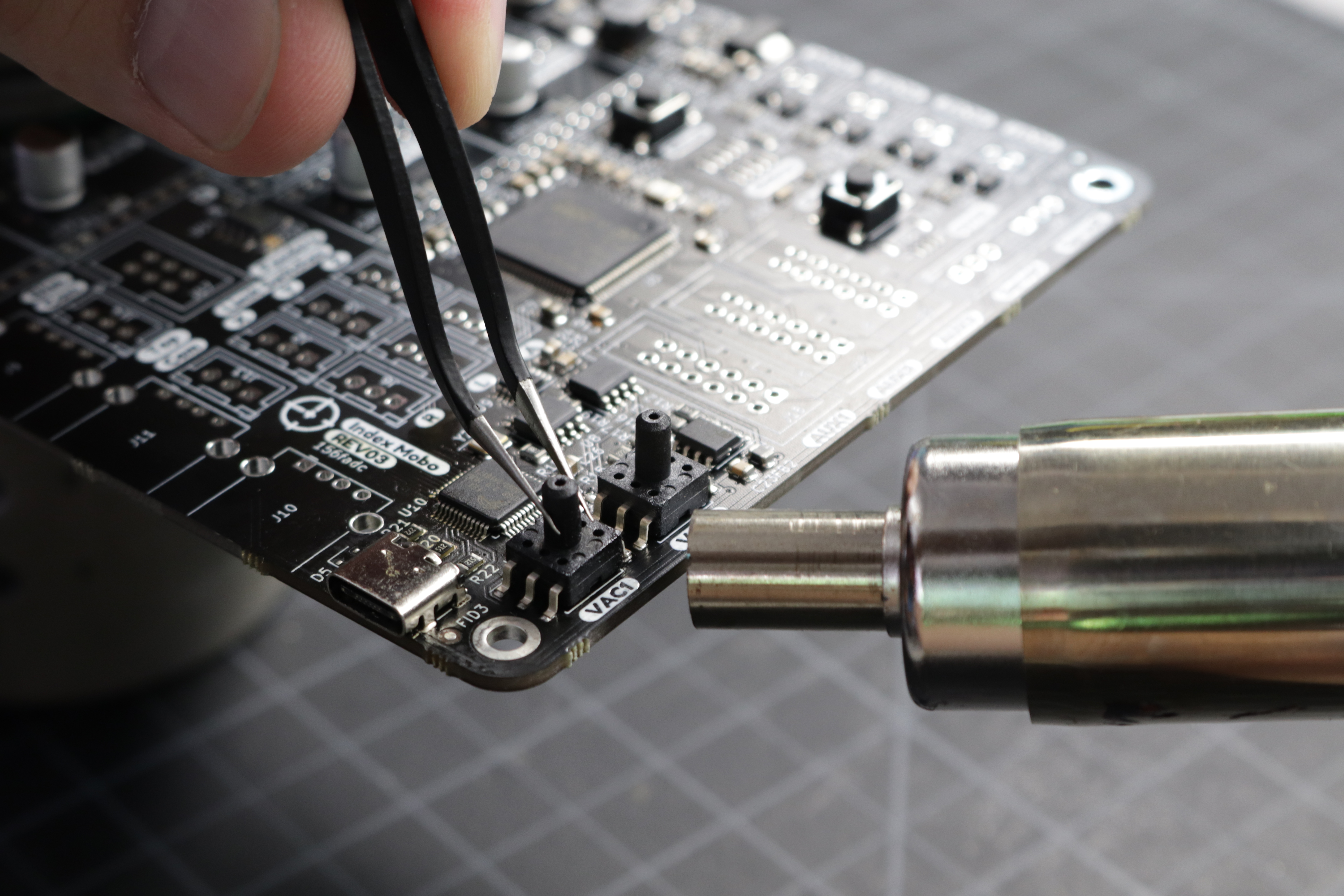 A photo of hot air being applied to the first sensor