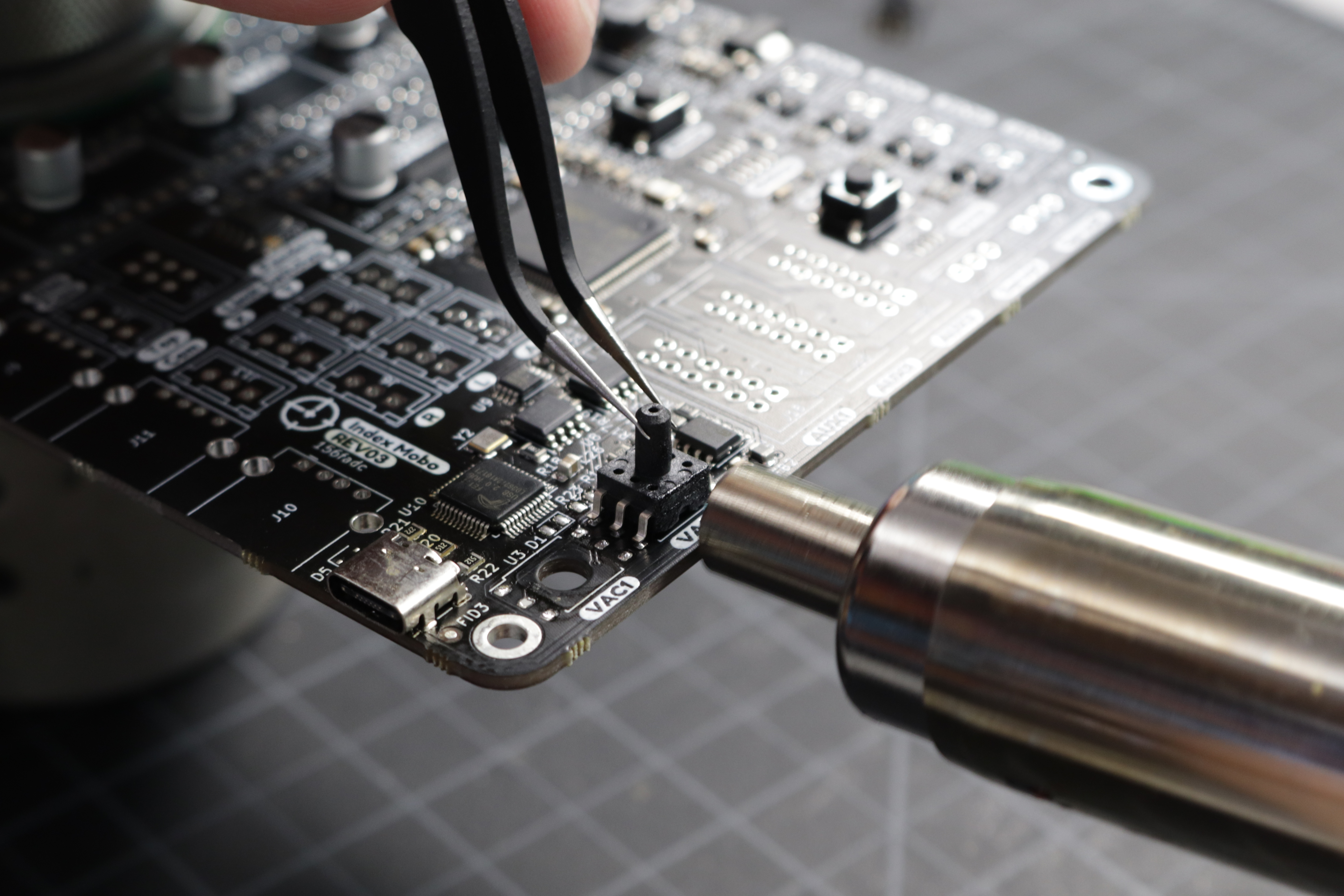 A photo of hot air being applied to the second sensor