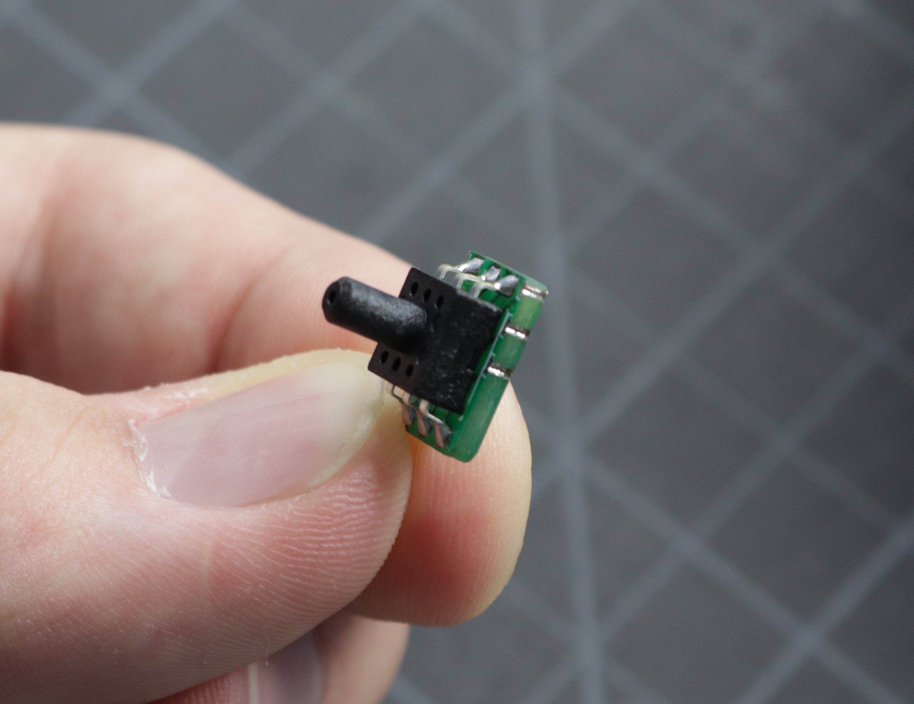 A photo of the front side of the interposer, with the three plated edges oriented towards the top