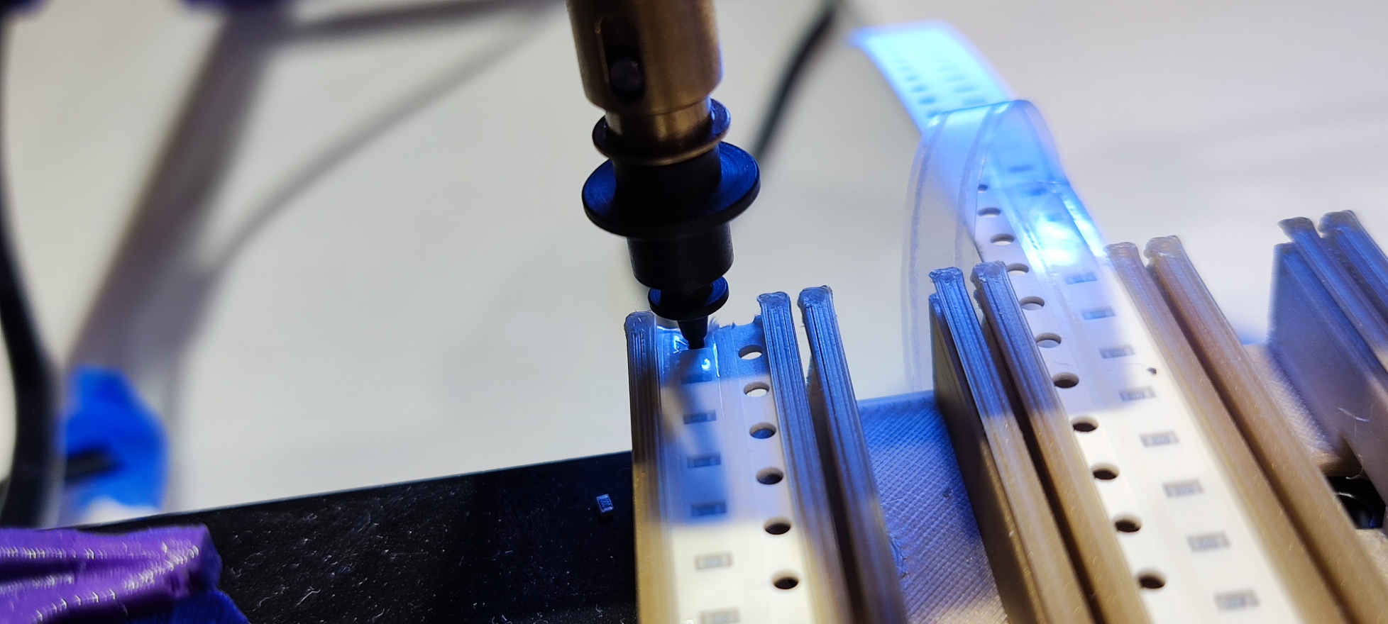 Position the nozzle over the feeder