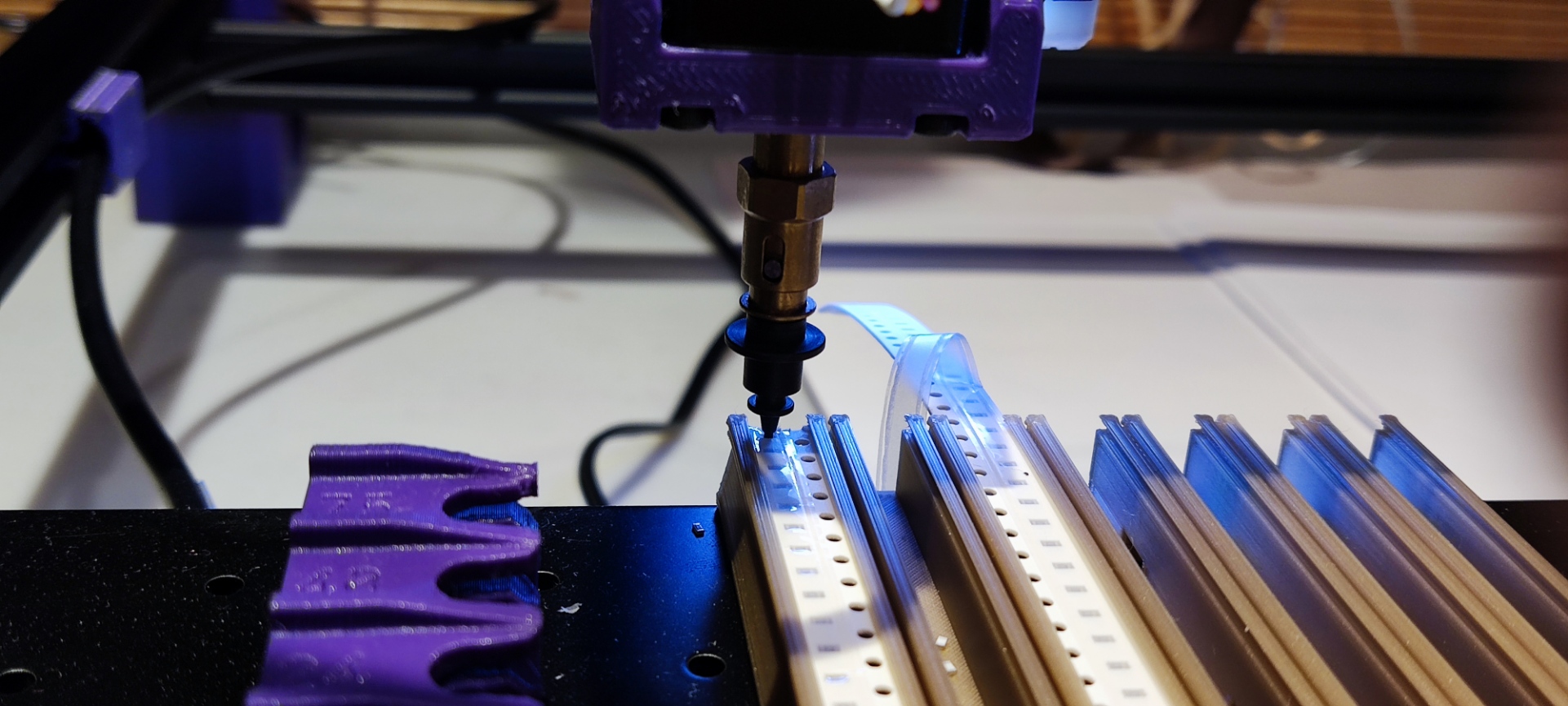 Position the nozzle over the feeder